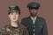 Portrait of young female US Marine Corps soldier with male officer in background