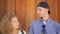 Portrait of Young Funny Couple LuAgainst Wooden Background. HD, Slowmotion.