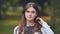 Portrait of a young Georgian girl in a park in summer.