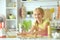 Portrait of a young girl baking in the kitchen