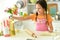 Portrait of a young girl baking in the kitchen