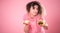 Portrait of a young girl with cupcakes in her hands