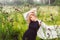 Portrait of young girl dancing in chamomile field