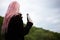 Portrait of young girl with pink hair holding steel thermo bottle.