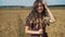 Portrait of young girl in summer field.