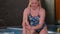 Portrait of a young girl swimming coach during a lesson with children.