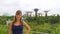 PORTRAIT: Young girl on vacation posing in the Marina bay garden on a cloudy day