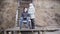 Portrait of young handicapped boy in wheelchair and adult woman looking at each other smiling and turning aside