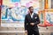 Portrait of young and handsome african american businessman in suit pose background carousel attractions