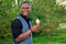 Portrait of young and handsome stylish model afro- american man in a stylish blue suit in a summer park clever latino