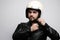 Portrait of young happy biker man with white cafe-racer helmet. White background.