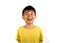 Portrait of young happy and excited child smiling and laughing cheerful wearing yellow t-shirt isolated on white background in kid