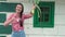 Portrait of a young happy farmer girl with a onion in her hands