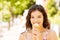 Portrait of young happy woman eating ice-cream