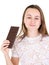 Portrait of young healthy pretty woman holding chocolate bar