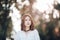 Portrait of young hipster Asian girl posing in the autumn park forest bokeh background