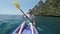 PORTRAIT: Young male having fun paddling kayak in picturesque Phi Phi Islands.