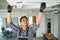 Portrait of young male indian technician repairing air conditioner. Air conditioner repairs.