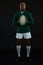 Portrait of young male rugby player holding ball