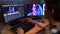 Portrait of young man in casual closing sitting at the desk working on pc editing video, closeup shot.