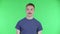 Portrait of a young man looking at the camera with a wow enthusiastic expression. Cute male with a mustache in a blue t