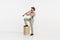 Portrait of young man playing clarinet isolated over white studio background. Expressive performance