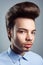 Portrait of young man with retro classic pompadour hairstyle