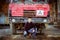 Portrait of young man sitting in in front of truck