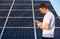 Portrait of a young man by solar panels