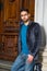 Portrait of Young Man standing by office door