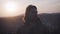 Portrait of a young man at sunset. Long curly hair