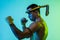 Portrait of young man thai boxer training over blue background.