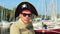 Portrait of young man wearing pirate hat, yachting, sailing