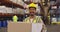 Portrait of young man working in a warehouse smiling 4k
