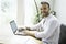 Portrait young mexican attractive businessman working at modern home office with computer laptop