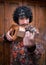 Portrait of a young Mexican musician posing with his jarana guitar as if it was a weapon