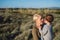 Portrait of young mother with small daughter in mediterranean nature.