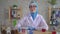 Portrait young muslim woman scientist chemist in national scarf working in the lab