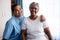 Portrait of young nurse with patient in nursing home