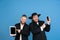 Portrait of a young orthodox jewish men  on blue studio background, meeting the Passover, winners