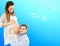 Portrait of young pair pending the kid isolated on blue background, Young attractive couple: pregnant mother and happy father,