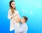 Portrait of young pair pending the kid isolated on blue background, Young attractive couple: pregnant mother and happy father,