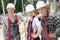 Portrait of young people with helmets in construction