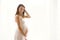 Portrait of young pregnant attractive woman, standing by the win