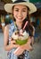 Portrait of young pretty woman holding Coconut Icecream