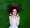 Portrait of a young redhead woman with styled glasses lying down