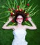 Portrait of a young redhead woman with tulips and glasses