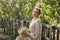 Portrait of a young romantic beautiful girl with a bunch of daisies on a summer walk