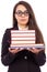 Portrait of a young serious teacher with glasses holding books