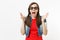 Portrait of young shocked scared woman with opened mouth in 3d glasses and casual clothes watching movie film and